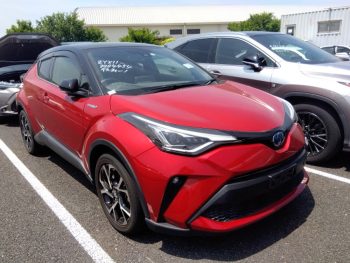 Vibrant red 2019 Toyota C-HR G LED New Shape displayed in a parking lot, showcasing its sleek design and modern features at Car Planet