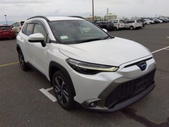 2022 Toyota Corolla Cross Z Hybrid in white, parked at a car dealership in Bangladesh, featuring modern SUV design and hybrid technology