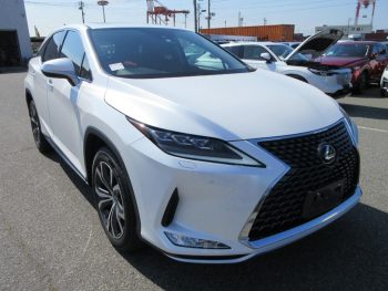 Front view of a white Toyota Lexus RX300H hybrid SUV, showcasing its sleek design and distinctive grille, parked in an outdoor car lot. This luxury vehicle emphasizes performance and eco-friendly features, ideal for premium car buyers.